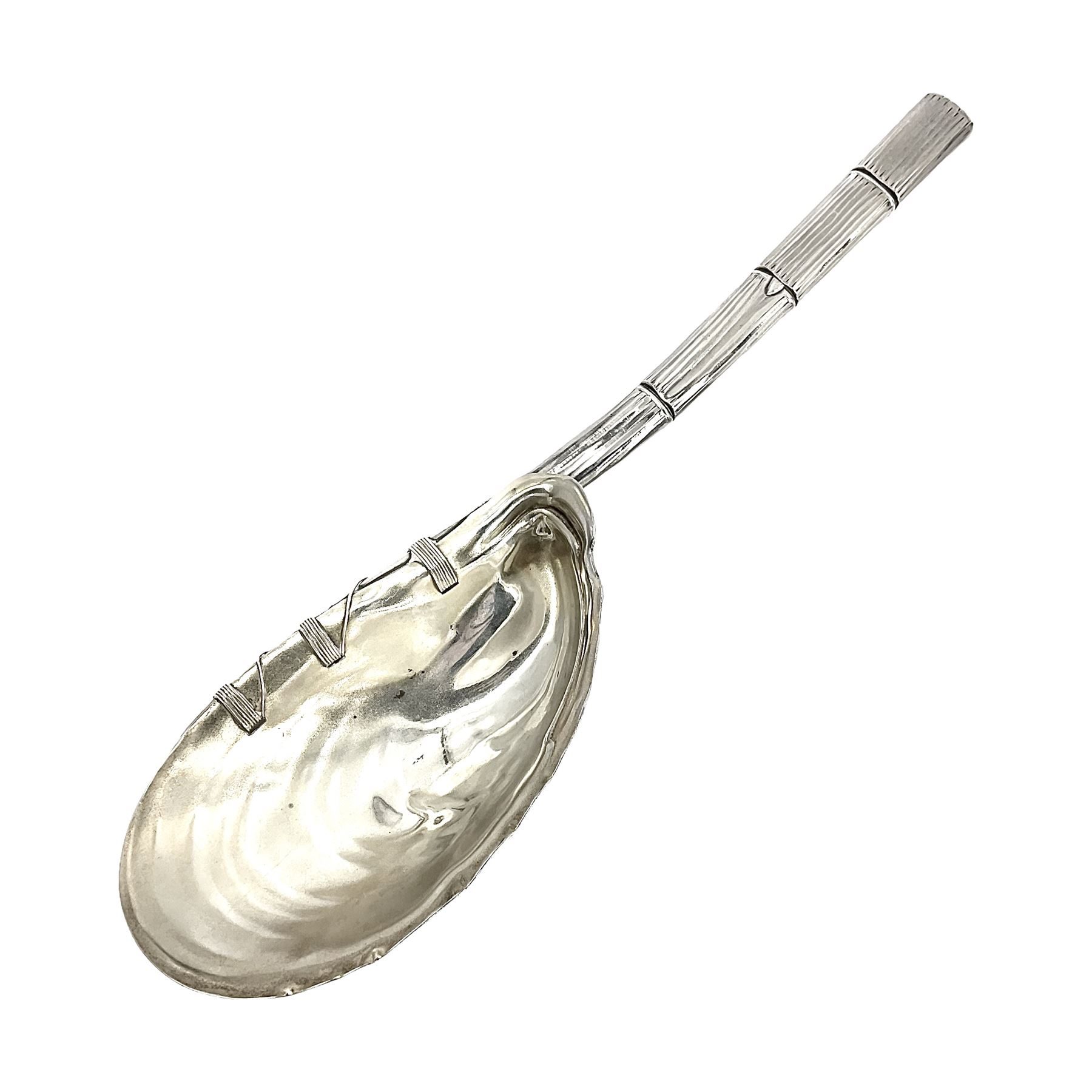 Mid/late 19th century Gorham silver serving spoon, circa 1863-1890, the bowl modelled as an oyster shell with silver gilt interior, affixed to the bamboo handle with silver twine, the bowl with marks for Gorham and impressed Sterling 330, L26.5cm
