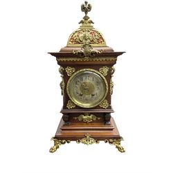 Lenzkirch - Edwardian German 8-day  mantle clock in an oak case with brass mounts and a pierced dome pediment with finial, silvered dial with Arabic numerals, gilt hands and dial centre, rack striking movement, striking the hours and half-hours on a coiled gong. With pendulum and key.