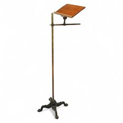 Victorian mahogany and brass adjustable music stand, tilting rest with edge, height adjustment mechanism to central column, supported on cast iron quadriform base