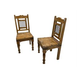 Pair of hardwood chairs, with wrought metal brackets and splat, turned front supports