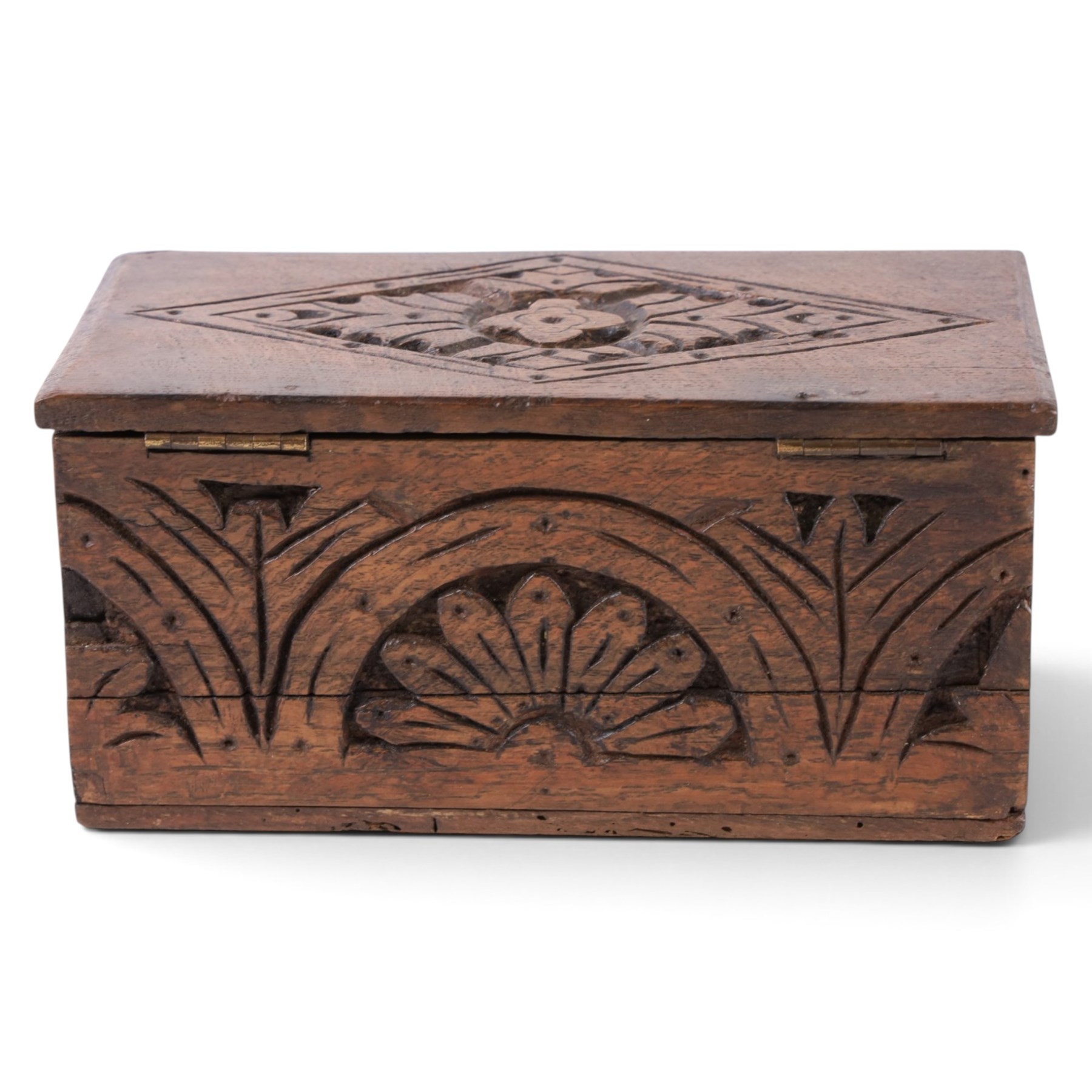 Carved oak box, the hinged lid with a carved diamond motif, the sides and front carved with stylised flowers, H12cm, L24cm
