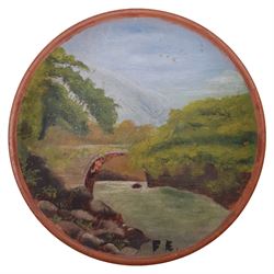 Attrib. Frederick (Fred) William Elwell RA (British 1870-1958): Bridge over the River, oil on terracotta dish signed with initials, inscribed on paper label verso 13cm diameter