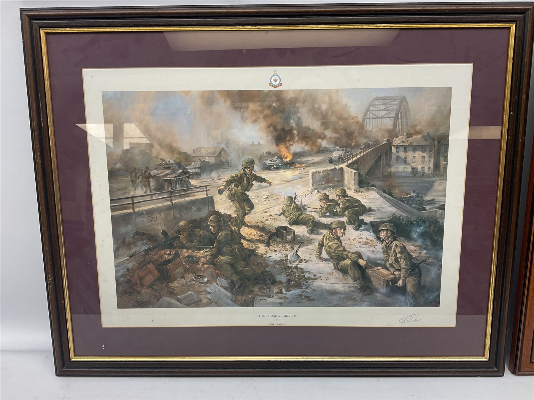 After Alan Fernley, colour print 'The Bridge at Arnhem', signed on the mount, 37 x 50cm; and after John Sellars, colour print 'Pegasus Bridge. Early Morning of D-Day 6th June 1944 Benouville Normandy'; both in mahogany stained frames (2)