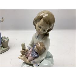 Four Lladro figures, comprising Hello Flowers no 5543, Dozing no 5155, Thoughtful Caress no 5990 and Little Girl with Slipper no 4523, together with a Lladro plaque and Lladro 1994 Easter egg, all with original boxes, H21cm