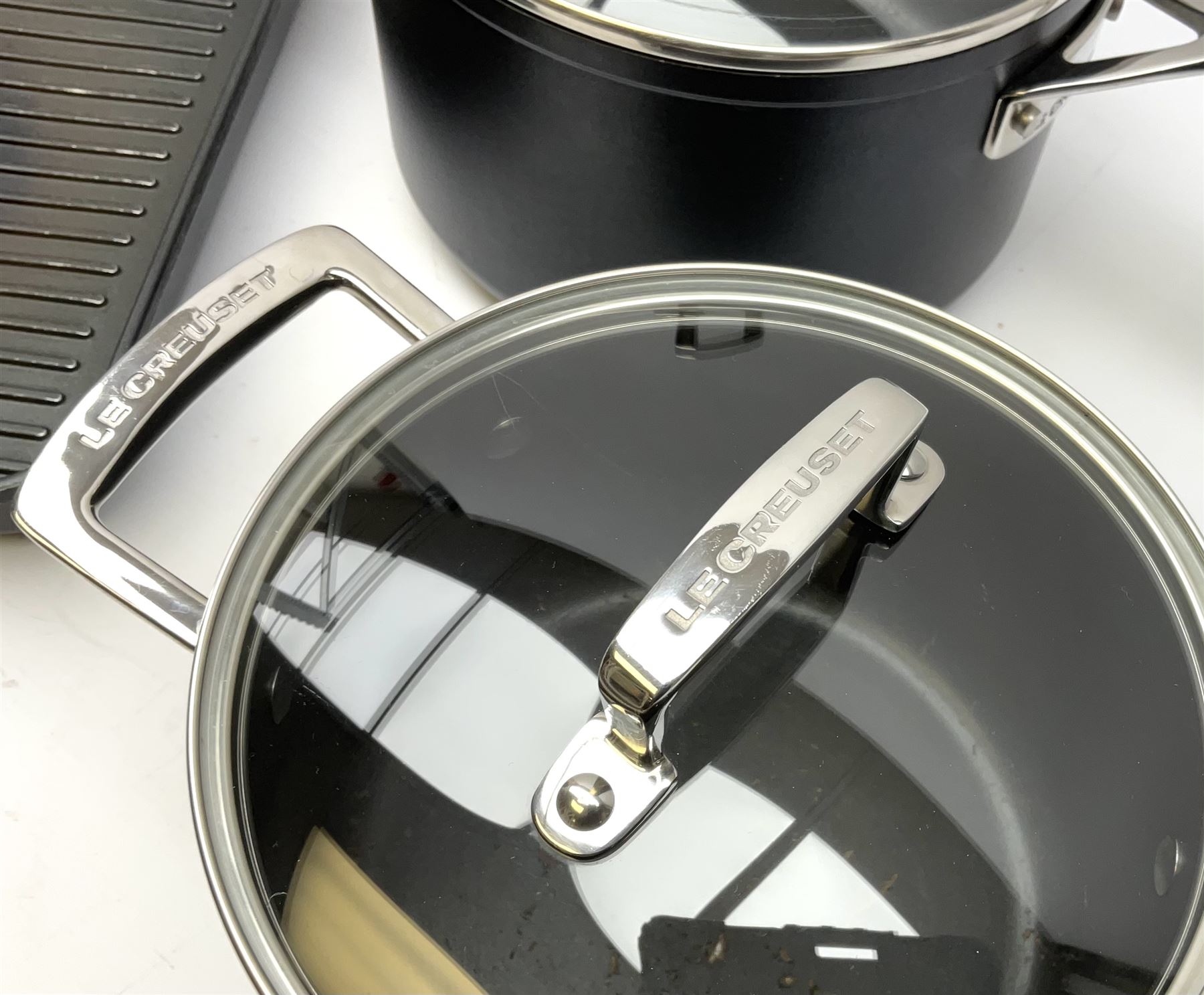 Three Le Creuset pans suitable for induction hobs inc. griddle pan