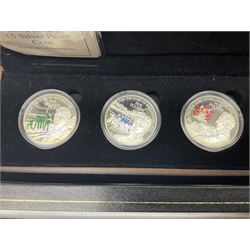 The Royal Mint United Kingdom 1977 silver proof two coin set, Queen Elizabeth II 2002 silver proof three coin set, comprising Bailiwick of Jersey, Bailiwick of Guernsey, and Alderney five pound coins, 'First Coinage of the British Virgin Islands' proof set, 1997 1/10 ounce fine silver Britannia, two King George V 1935 'Rocking Horse' crowns, various Isle of Man commemorative crowns, etc., house in a hard shell carry case
