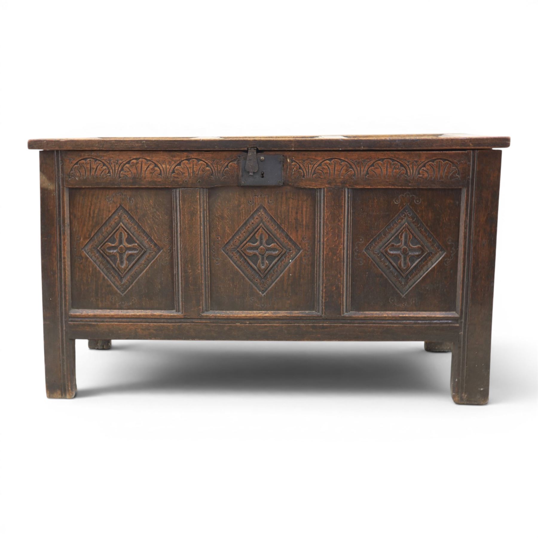 18th century style oak coffer, panelled rectangular top hinged to reveal storage with candle box, carved frieze and front panels, raised on stile feet