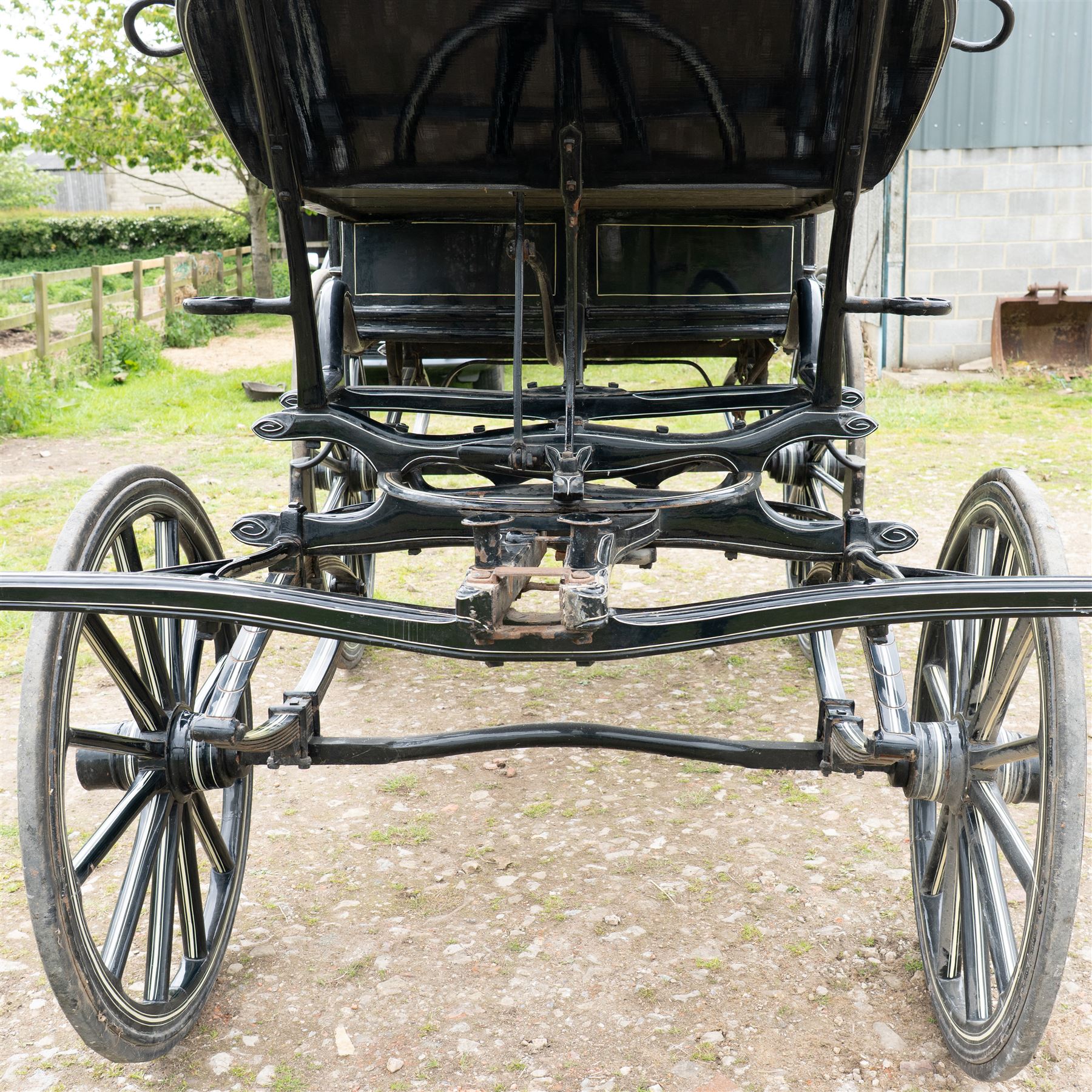 Victorian Glass Hearse

A black painted four wheeled horse drawn glass hearse with extensively glazed coffin compartment, etched glass side and end panels, decorative gilt cresting, gilt column capitals, white painted interior bier deck, metal coffin rails with cross finials, rear glazed access doors, external coachman's box seat for two, wooden spoked wheels the wheel hubs stamped 'The Economic Funeral Co', leaf spring suspension, underbody turntable steering and pole for driving with a pair of horses. The hearse has decorative painted lining throughout and an ornate black and gilt body with curved glass panels to the sides and rear.

Features

• Extensively glazed coffin compartment
• Etched glass side and end panels
• Decorative gilt cresting
• Gilt column capitals
• White painted interior bier deck
• Metal coffin rails with cross finials
• Rear glazed access doors
• External coachman's box seat
• Wooden spoked wheels
• Leaf spring suspension
• Underbody turntable steering
• Pole for driving with a pair of horses
• Decorative painted lining

Dimensions:
Overall length: 406 cm
Body length: 250 cm
Overall width: 190 cm
Body width: 115 cm
Height: 228 cm

Wheel Diameters:
Front wheels: 102 cm
Rear wheels: 133 cm

Seating

Coachman's box seat: 2