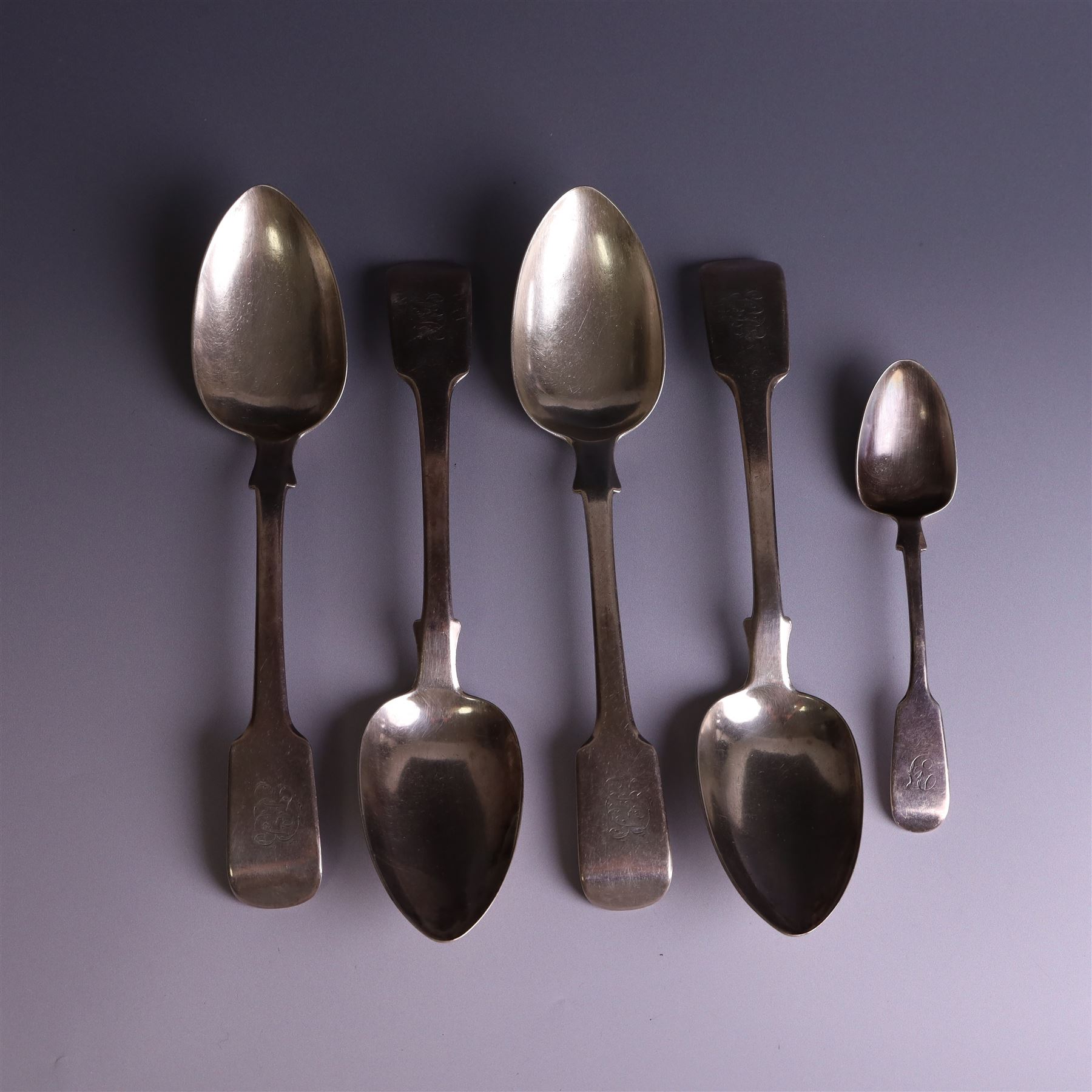 Set of four George III silver Fiddle pattern table spoons all engraved with monogram, hallmarked Thomas Wallis (II) & Jonathan Hayne, London 1819, together with a  Victorian silver Fiddle pattern teaspoon with engraved initials, hallmarked William Rawlings Sobey, Exeter 1846