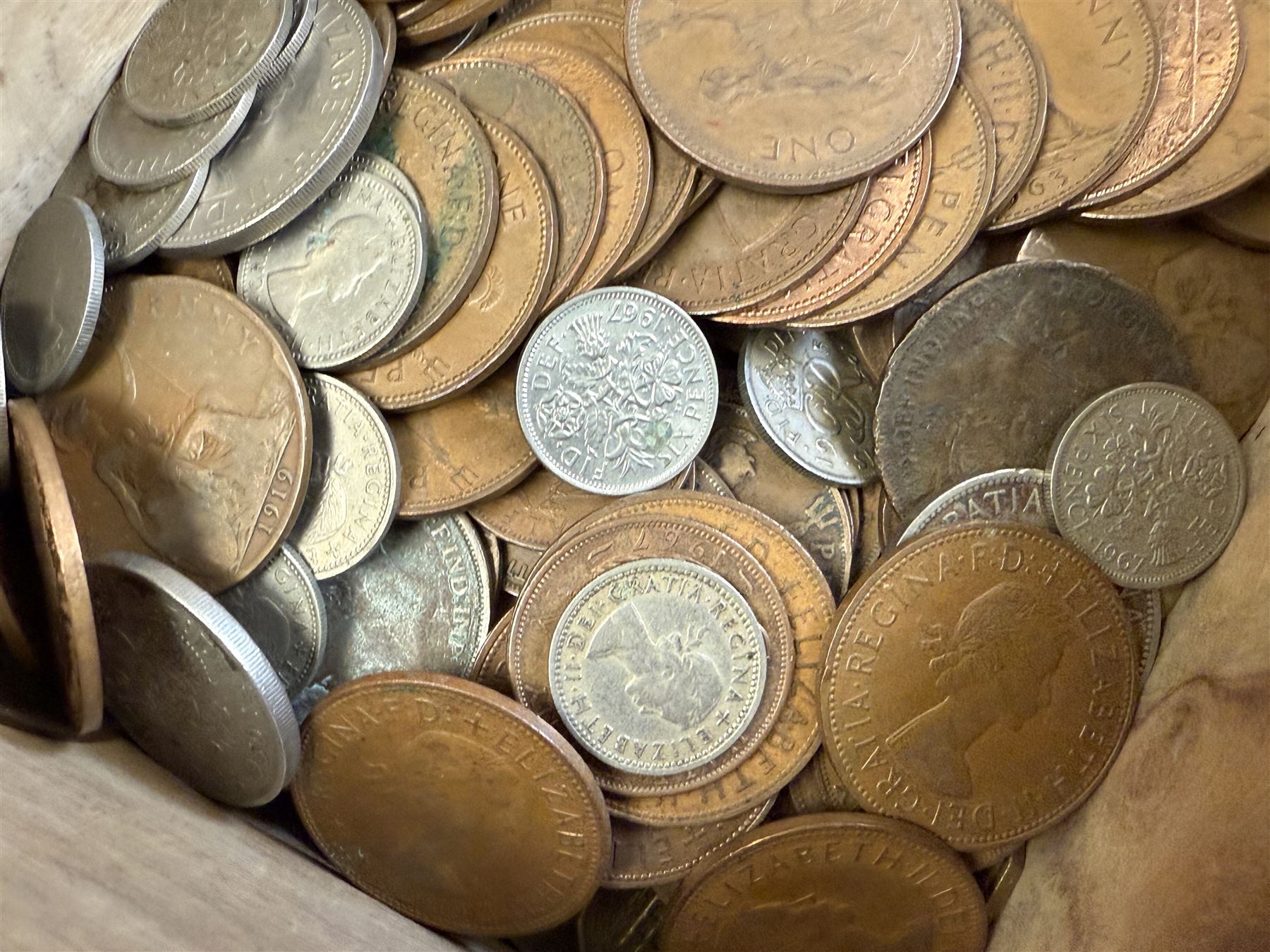 Approximately 115 grams of Great British pre-1947 silver coins, and further pre-decimal coins, housed in a miniature carved camphor wood chest