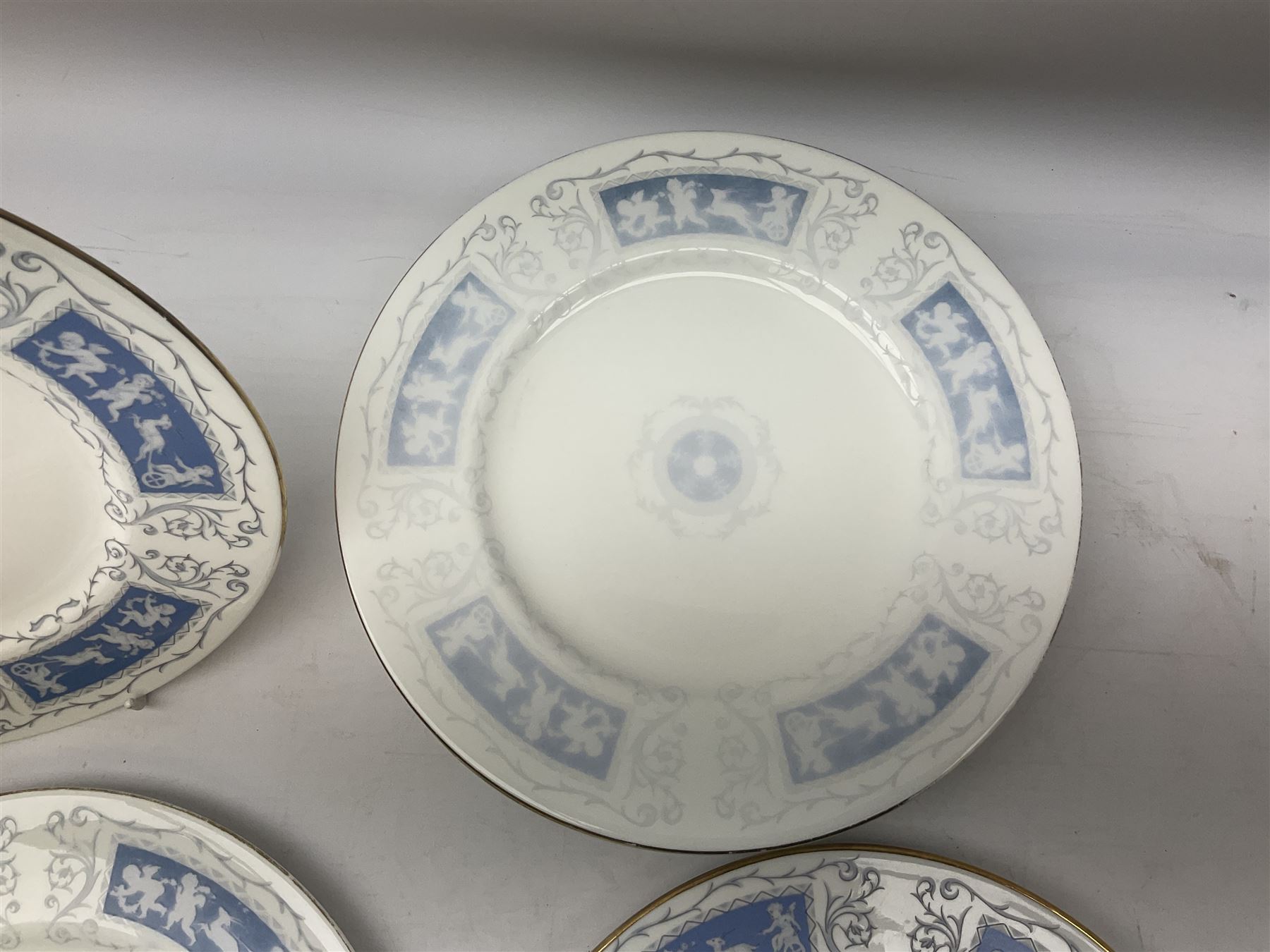 Coalport Revelry pattern tea and dinner wares, comprising nine dinner plates, four salad plates, eleven side plates, sauce boat and stand, ten teacups and ten saucers, and preserve pot and cover, together with a Coalport plate of shaped form decorated with pink roses, and a Royal Crown Derby Royal Antoinette pattern trio