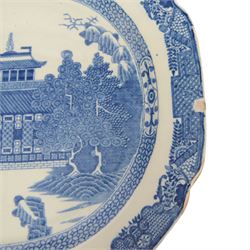 Pair of large 19th century blue and white platters, decorated in the Long Bridge pattern with pagodas, boats and figures, within a decorative border with scrolls, D39.5cm W52cm