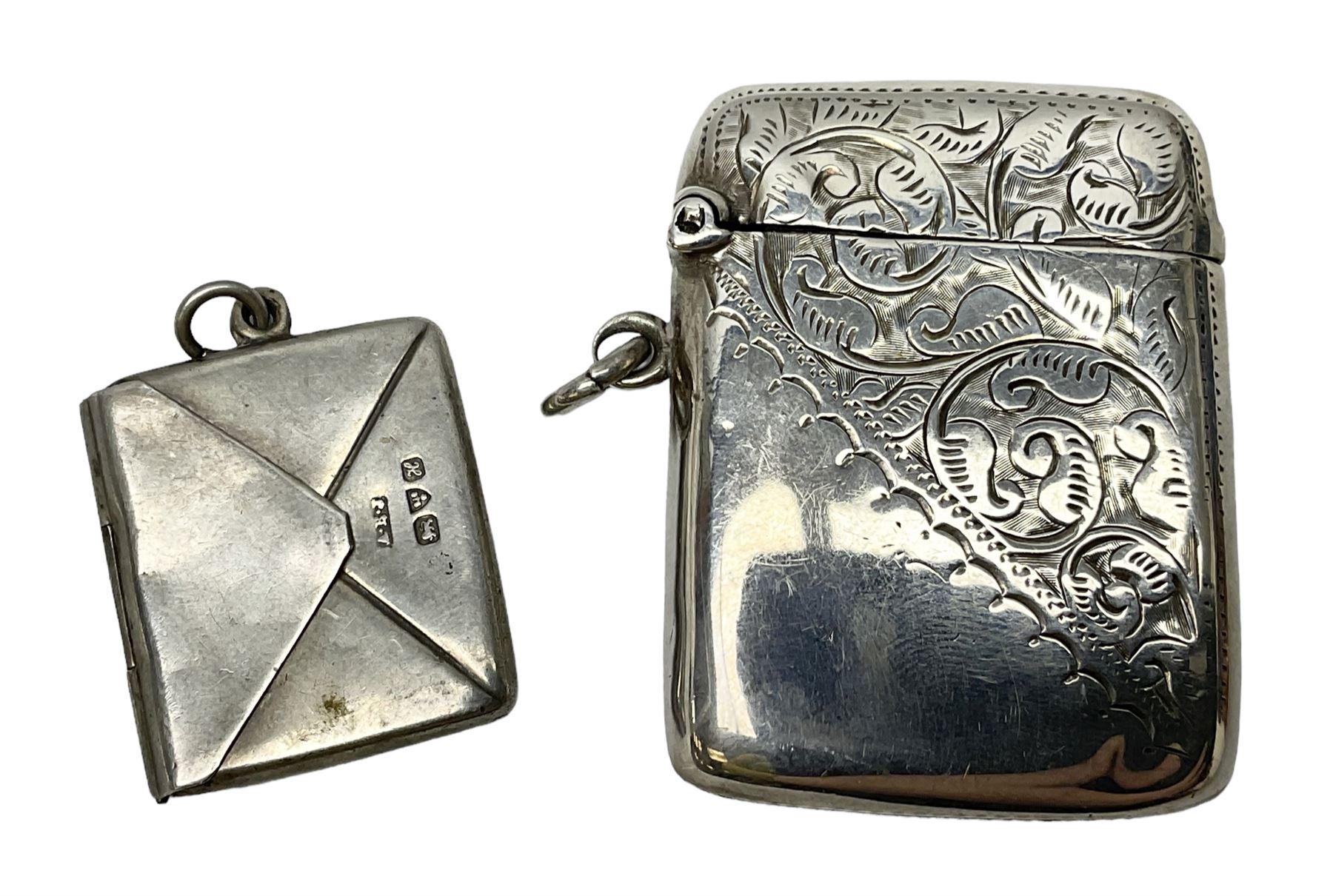 Silver stamp case modelled in the form of an envelope, together with a