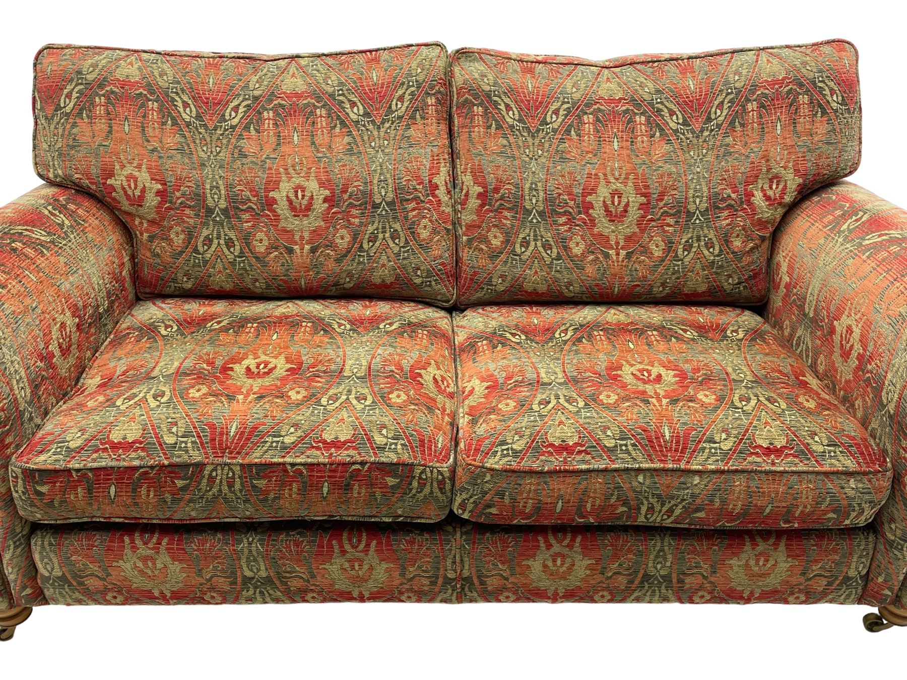 Duresta - 'Beaminster' grande two-seat sofa, traditional shape with rolled arms, upholstered in 'Althorp' russet and stone floral pattern fabric, on turned feet with brass castors
