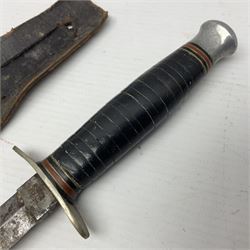  British Private Purchase fighting knife by William Rodgers, Sheffield, the 15cm double edge steel blade with raised medial ridge, stamped on one side of the ricasso WILLIAM RODGERS I CUT MY WAY, the opposing side marked MADE IN SHEFFIELD, ENGLAND, with aluminium crossguard and pommel, stacked leather washers grip and leather scabbard L27.5cm overall; and a crudely made short sword with 32.5cm single edged blade and steel knucklebow hilt with hardwood grip; in cane bound wooden scabbard L45cm overall (2)