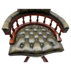 Captain's swivel desk chair, upholstered in studded green leather