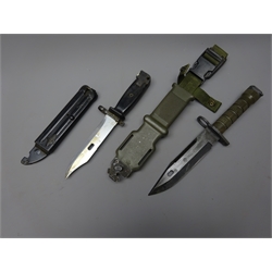  USA M9 Bayonet, 18cm single edge part top serrated blade stamped LanCay USA, ribbed grip L31cm, in plastic and metal scabbard with belt clip and a similar Bayonet, 15cm blade, moulded handle and metal scabbard stamped 334473, (2)  