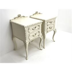 Pair late 20th century French style white and gilt bedside chests, raised shaped back, two drawers, acanthus carved cabriole legs