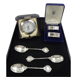 Silver mounted quartz alarm clock by Carr's of Sheffield Ltd, 2000 cased, two silver napkin rings boxed and three silver teaspoons, all hallmarked