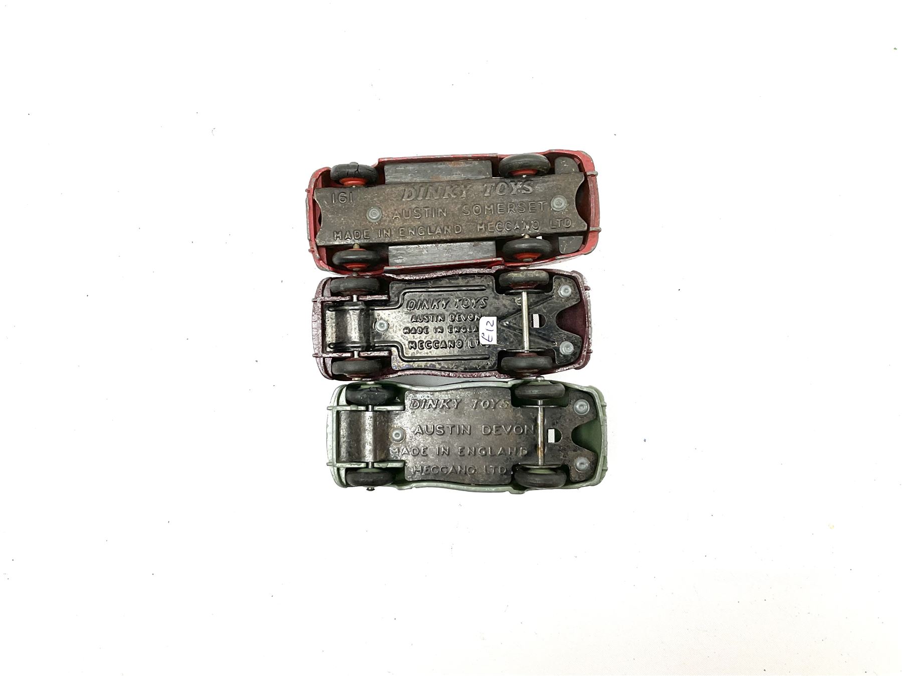 Dinky - seven unboxed and playworn die-cast cars comprising Studebaker, Ford Sedan, Rover 75, Vanguard, Austin Somerset and two Austin Devons; together with two Dublo size scale cars (9)