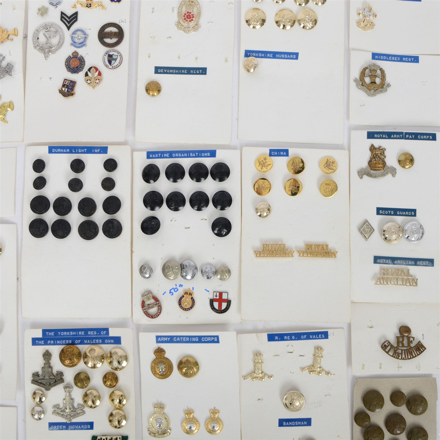 Collection of military cap badges, buttons and similar, including examples for Royal Army Medical Corps, Royal Army Pay Corps, Royal Engineers etc 