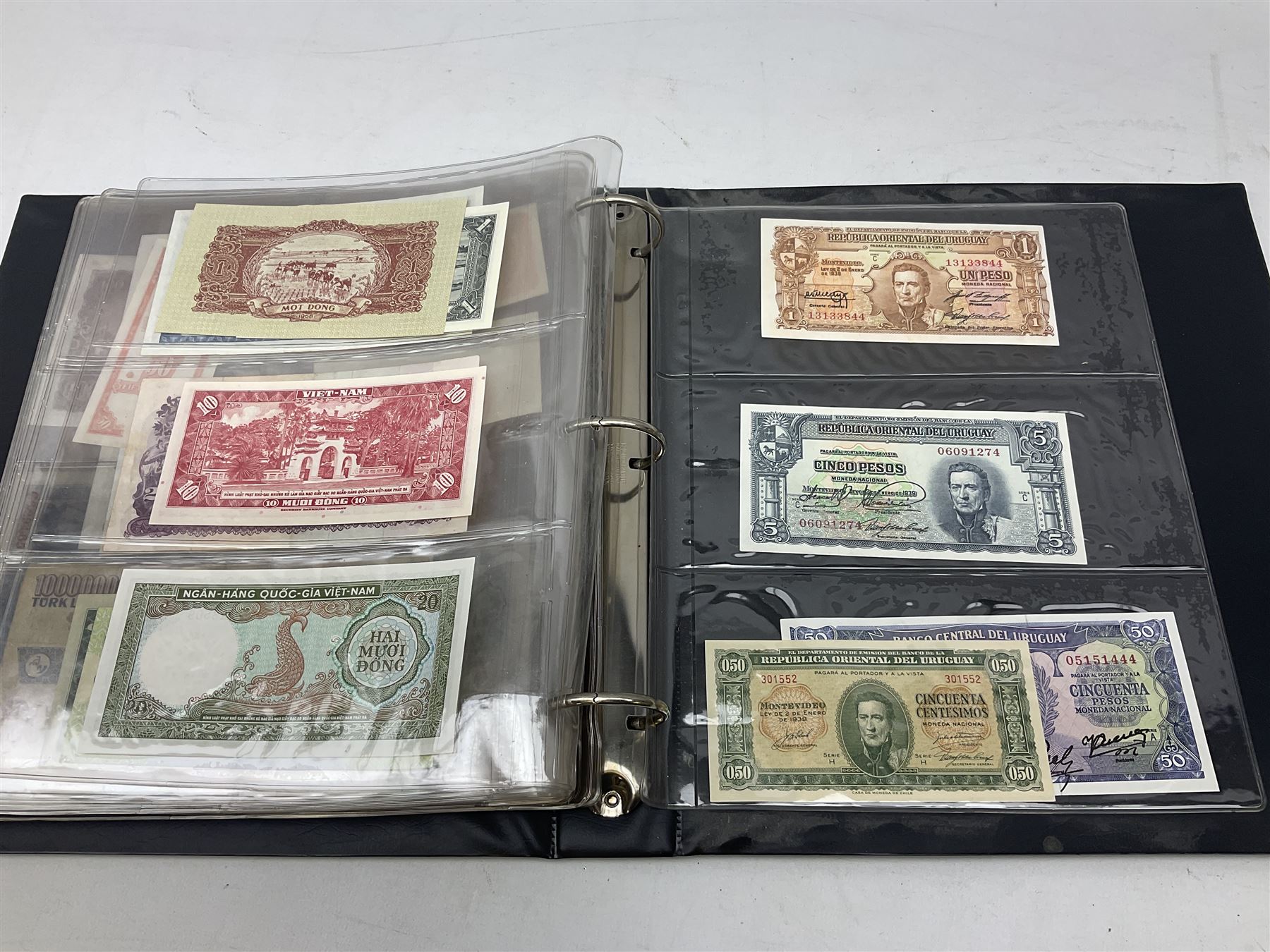 World banknotes, including Queen Elizabeth II The States of Jersey one pound 'DB202703', five pounds 'BB527762' and ten pounds 'AB651481', reserve bank of New Zealand two dollars '1L3 741894', King George V Straits Settlements one dollar 1st January 1935 'F/83 28924', various Bank of England notes etc, housed in two ring binder albums