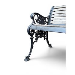 Victorian Andrew McLaren pattern cast iron bench, the ornate ends with detailed scrollwork, joined together with a cast iron seat and backrest frame supporting gently weathered oak slats, Victorian diamond stamp mark