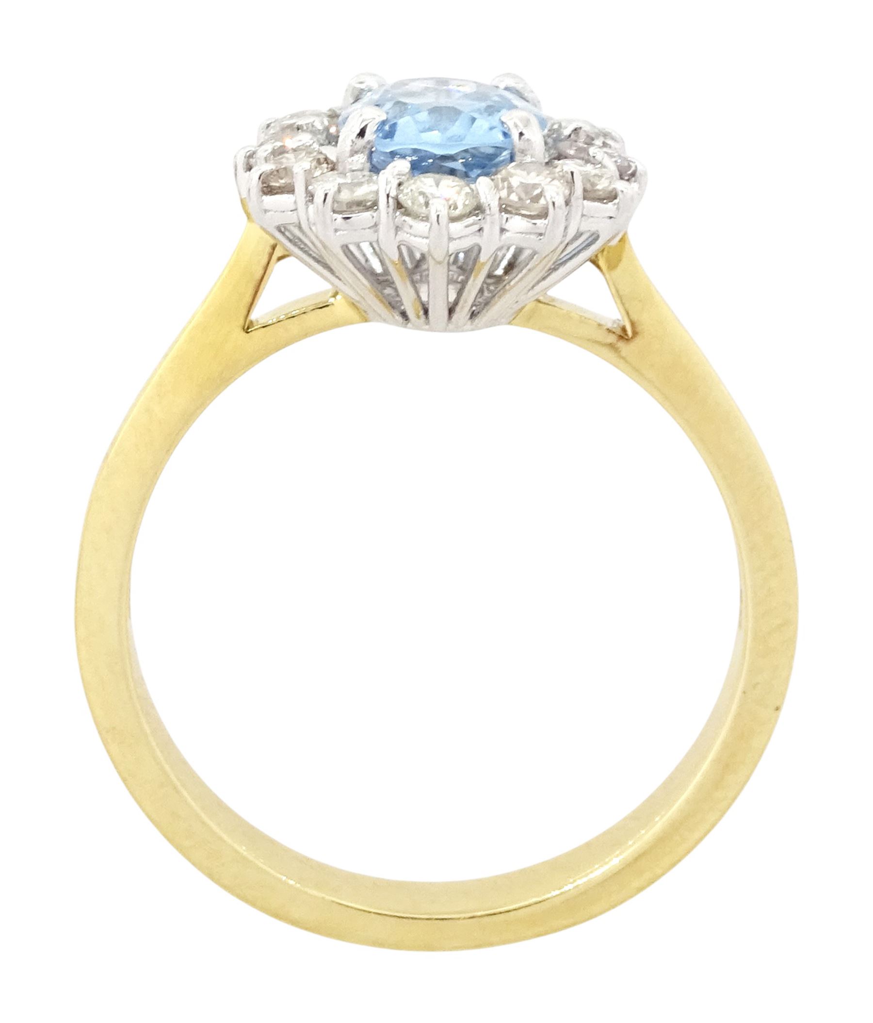 18ct gold aquamarine and diamond cluster ring, oval cut aquamarine of approx 0.80 carat, with round brilliant cut diamond surround, London 2022, total diamond weight approx 0.55 carat