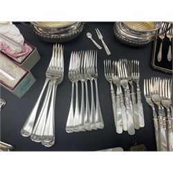 Mother of Pearl handled cutlery, with silver ferrules, comprising six fish knives and forks and six fruit knives and forks, the ferrules hallmarked Yates Brothers, Sheffield 1905, together with silver plated Edwardian three piece tea service and other flatware 