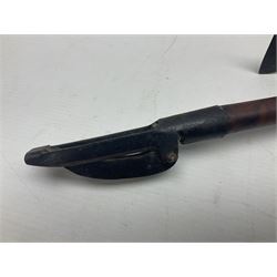 Two late 19th century fruit picker canes, the first example a French ebonised bamboo cane, with pair of fruit scissors to base, the handle stamped Cueille Fruit, the second example with grabbing action, the cap stamped A C Harris, Leicester, together with two other 19th century canes, one with fork and the other with hoe