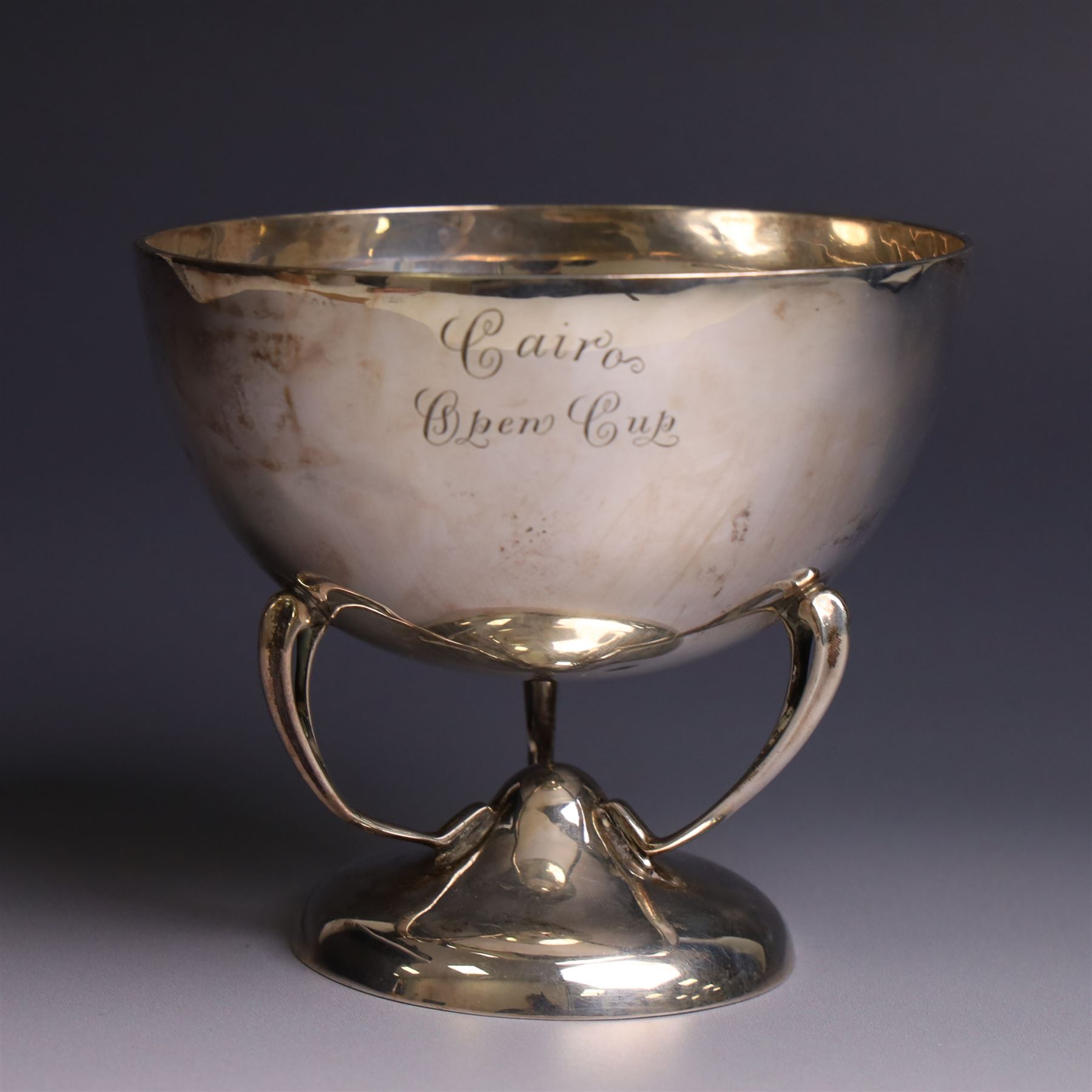 Art Nouveau silver trophy cup, engraved circular bowl upon three naturalistic curved supports,and a circular foot, engraved 'Cairo's Open Cup' to body, H11cm