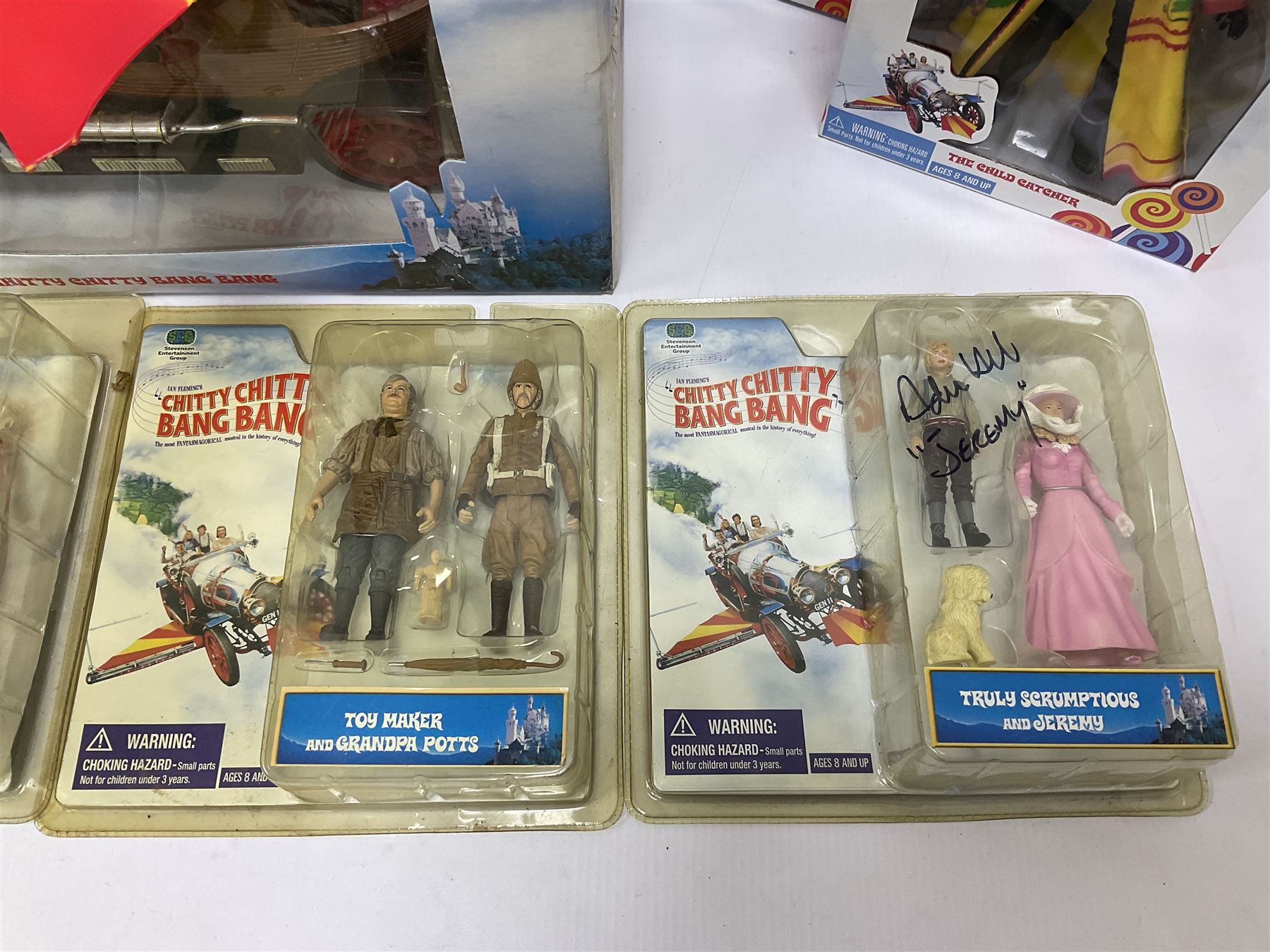 Collection of Chitty Chitty Bang Bang figures and model cars both loose and boxed, to include ‘Truly Scrumptious and Jeremy’ blister pack signed by Adrian Hall