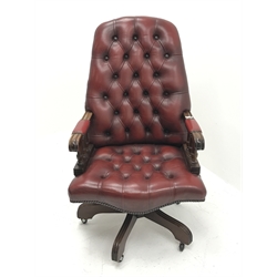 Swivel reclining desk chair upholstered in deep buttoned oxblood leather, W60cm
