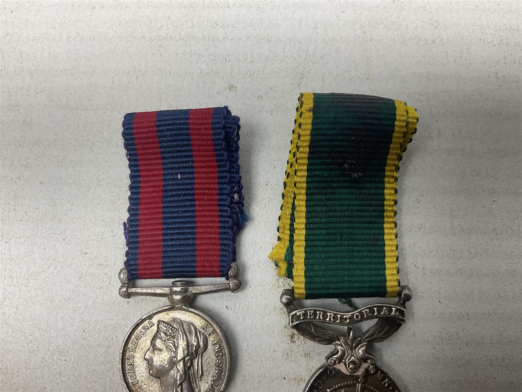 George V Military Medal and Distinguished Conduct Medal miniature group of seven medals comprising MM, DCM, WW1 trio including 1914 Star with date clasp and MID leaves, The Great Durbar Delhi 1911 Medal and LSGC; on pinned wearing bar; WW1 Military Medal miniature group of three comprising MM, BWM and Victory; Victoria North West Canada 1885 miniature; and George VI miniature Territorial Efficiency medal; all with ribbons