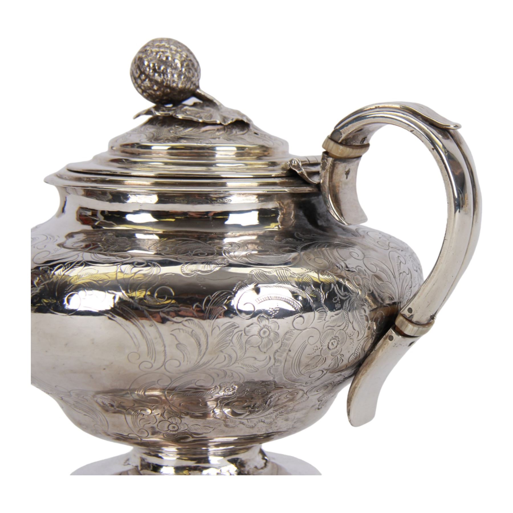 Victorian silver teapot, the body of bulbous form engraved with named cartouche and surrounded by flower heads and foliate scrolls, with capped strap handle with ivory insulator, and melon foliage mounted finial to the hinged lid, upon a circular stepped foot, hallmarked Francis David Dexter, London 1841, H17cm

This item has been registered for sale under Section 10 of the APHA Ivory Act