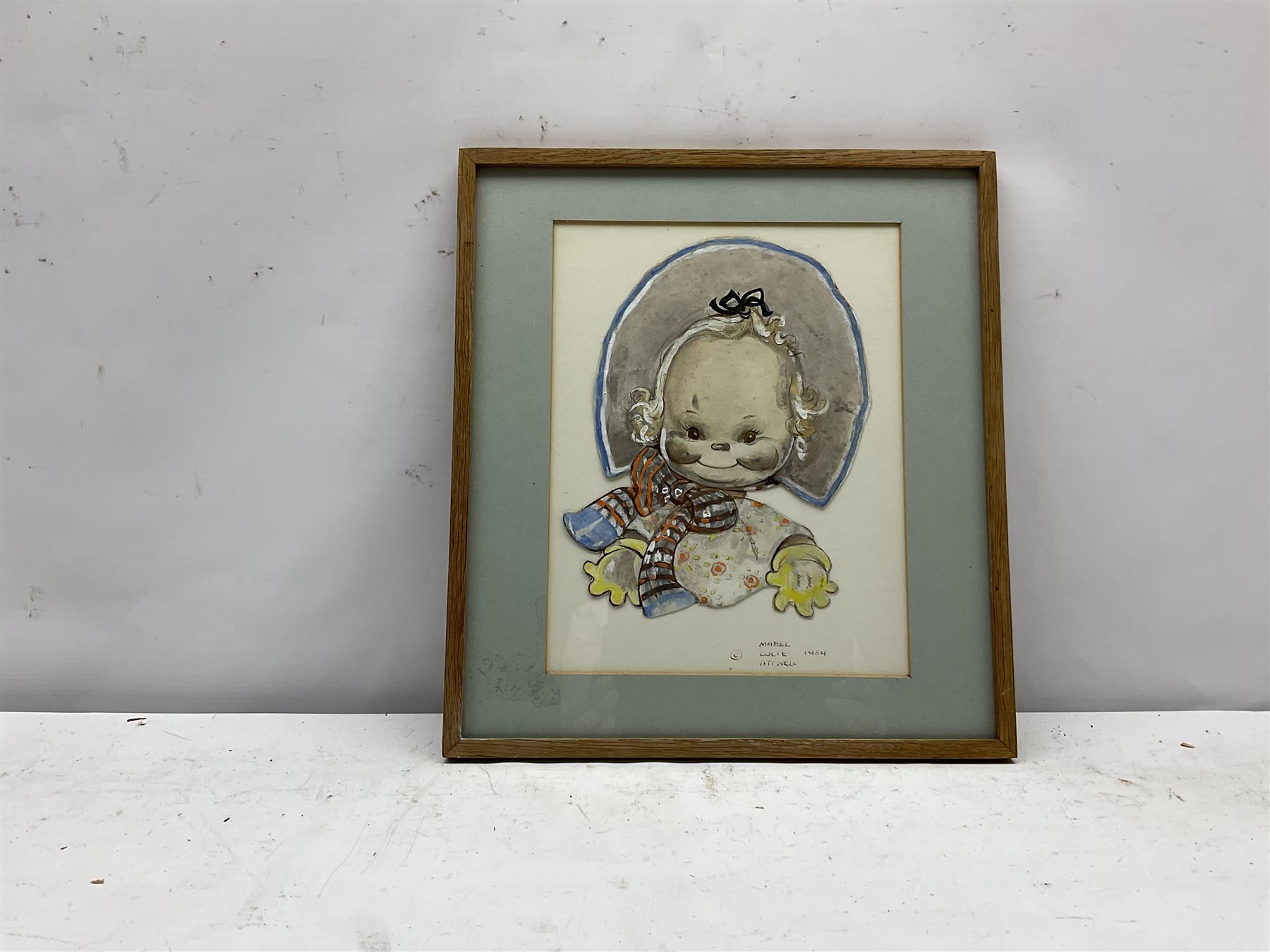 Mabel Lucie Attwell (British 1879-1964): 'Here's a Cheerio from Me', watercolour cut out and laid on paper signed and dated 1959, inscribed verso 24cm x 19cm
Notes: this subject was used in Postcard No.999 and calendars 1947 to 1950