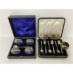 Cased set of six spoons by Cooper Brothers & Sons, two hallmarked silver decanter labels, four silver collared glass salts in box, further silver spoon and napkin ring