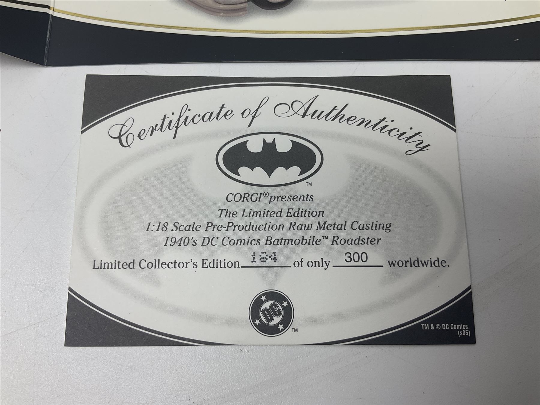 Two Corgi DC Comics die-cast Batmobiles comprising 1:18 scale die-cast Limited Edition Pre-Production Raw Metal Casting 1940 Batmobile Roadster no. 184/300, and 1:24 scale die-cast Limited Edition Raw Metal Casting 1960 Batmobile no. 858/1000, both with original boxes and certificates of authenticity 