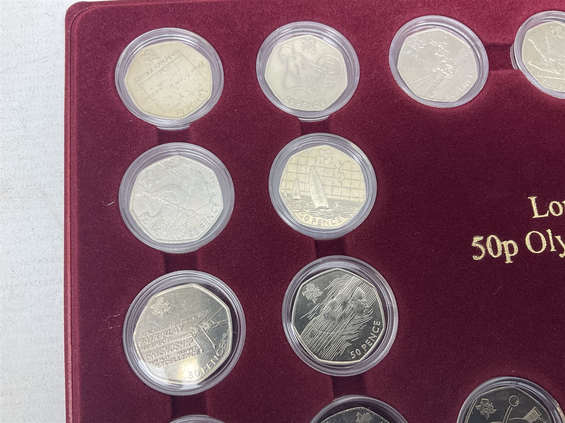 Queen Elizabeth II United Kingdom London 2012 Olympic commemorative fifty pence collection comprising twenty-nine coins, housed in unofficial display case