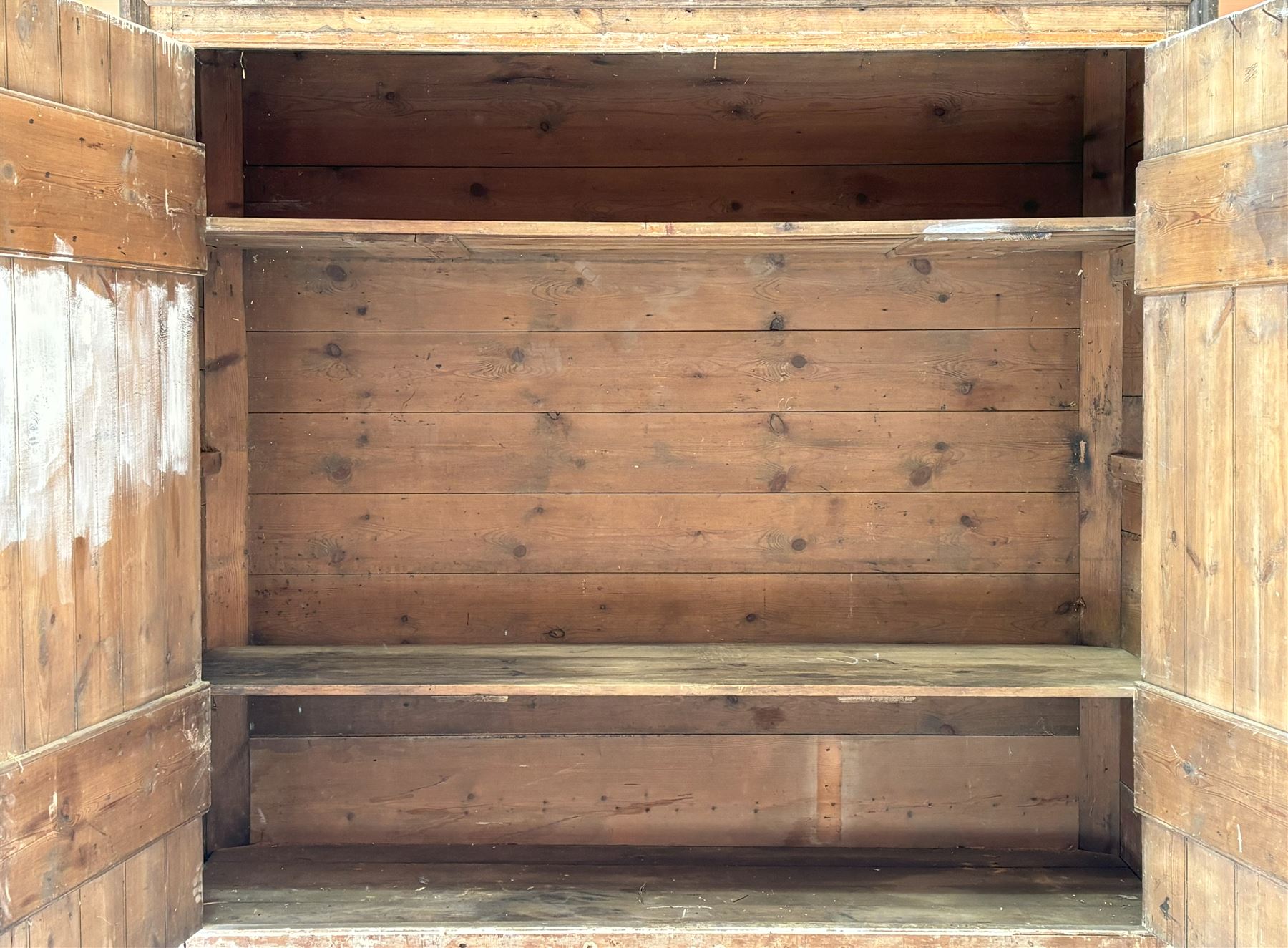 19th century pine country house kitchen cupboard, the two doors opening on strap hinges and enclosing two shelves. H174cm, W184cm, D61cm - COLLECTION BY APPOINTMENT FROM: The White House, Thirsk Road, Easingwold, York, YO61 3NF - CALL 01723 507111 TO ARRANGE