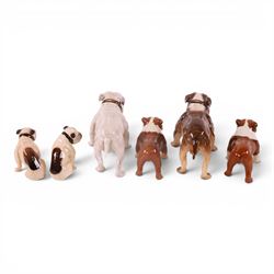 Two Royal Doulton Brindle bulldogs,1047, together with a pair of Beswick Bosun bulldogs and two others 