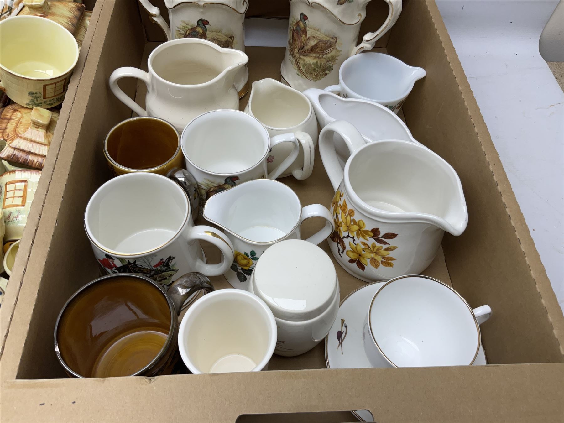 Two Poole Pottery dinner plates and a meat plate, four Copeland Spode Bermuda pattern dinner plates, Sadler jug, Keele St Pottery cottage tea wares, Torquay Motto ware, blue and white jug and bowl, two large planters and other ceramics, etc, in four boxes 