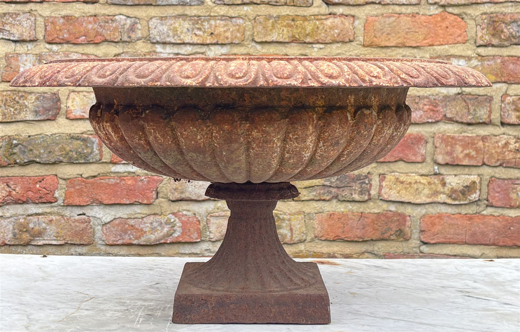 Victorian style cast iron garden urn, with egg and dart moulded rim above a reeded bowl and fluted socle. H27cm, D53cm - COLLECTION BY APPOINTMENT FROM: The White House, Thirsk Road, Easingwold, York, YO61 3NF - CALL 01723 507111 TO ARRANGE