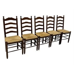 Set of ten 18th century design oak ladder back dining chairs, shaped cresting rail over four horizontal splats, rush seat raised on turned supports united by double stretchers