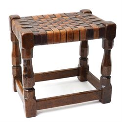 Mouseman - 1930s adzed oak joint stool, leather latticework seat on chamfered octagonal su...