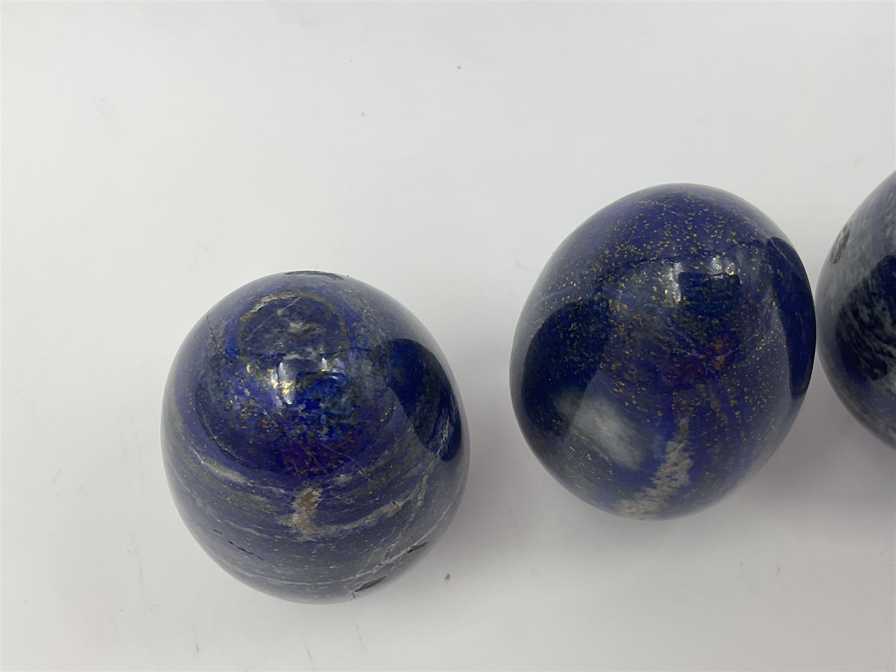 Collection of five Lapis lazuli specimen eggs, largest egg H7cm
