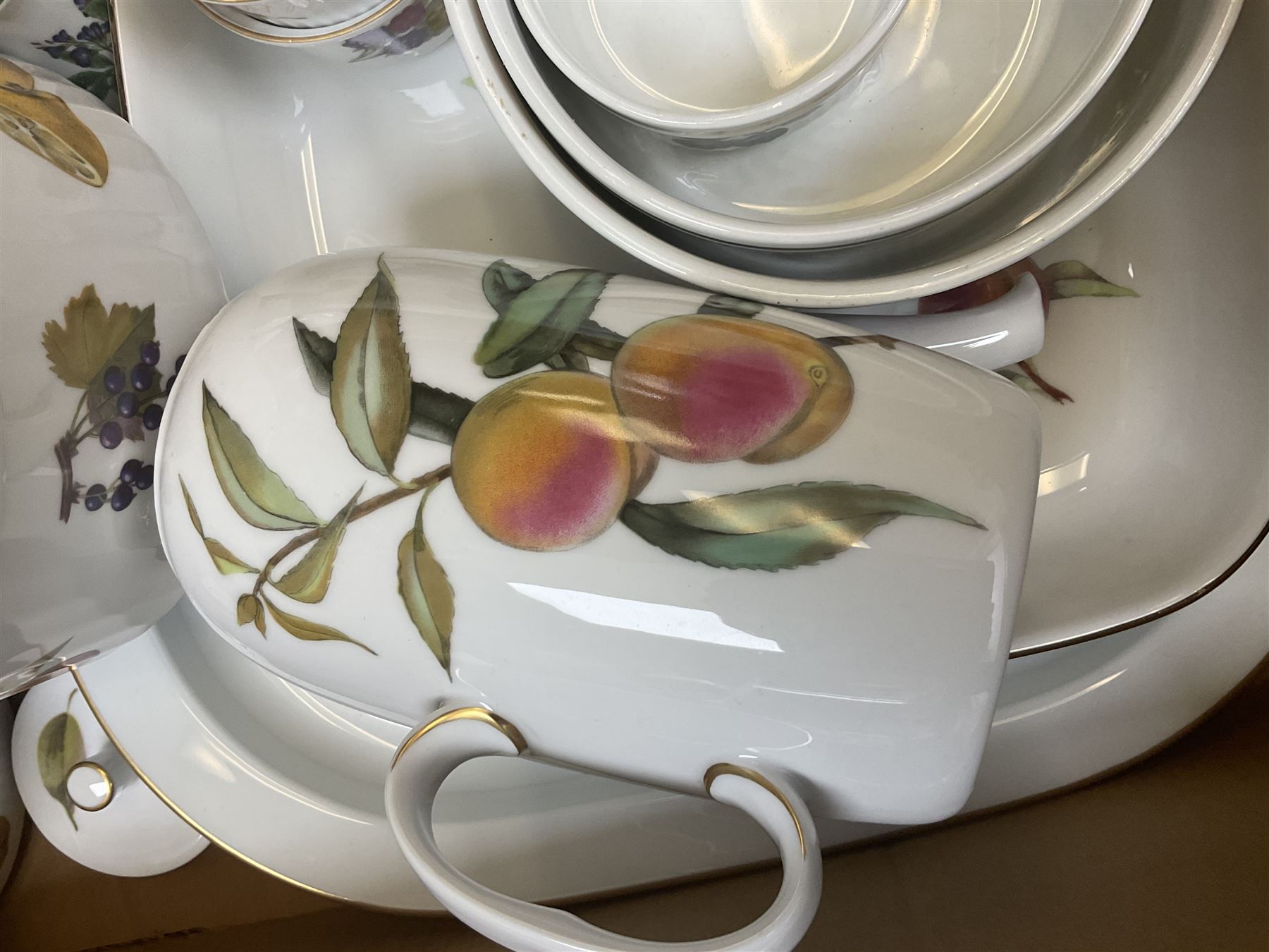 Royal Worcester Evesham and Evesham Vale tea and dinner wares, to include, three large covered tureens, coffee pot, eight tea cups and saucers, milk jug, two covered sucriers, boxed serving spoons etc, approx .130