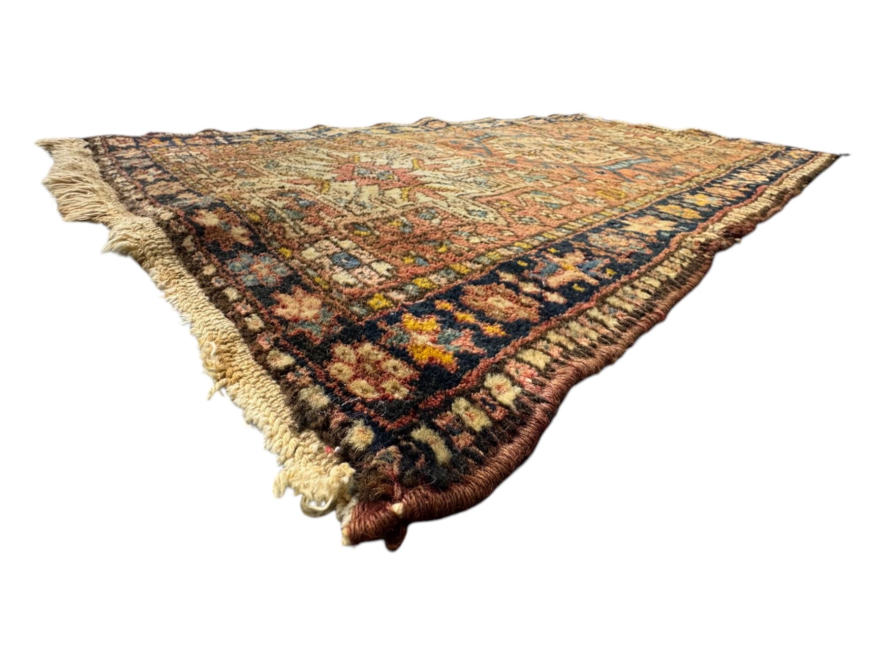Belgian Sultan woollen ground rug, central navy field densely decorated with floral sprays and geometric patterns (192cm x 135cm); handwoven tribal terracotta ground rug (121cm x 71cm); Persian crimson ground runner, all over stylised floral and foliate motifs (266cm x 94cm)