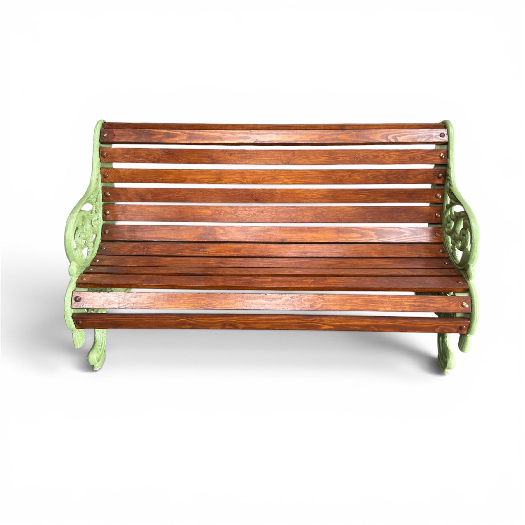 Pair of Victorian design cast iron and slatted wooden garden benches, the ornate pierced end supports of scrolled form, the pierced acanthus leaves interspersed with trailing flowerheads, with tassels to the front, raised on splayed feet, the supports in pale sage green painted finish