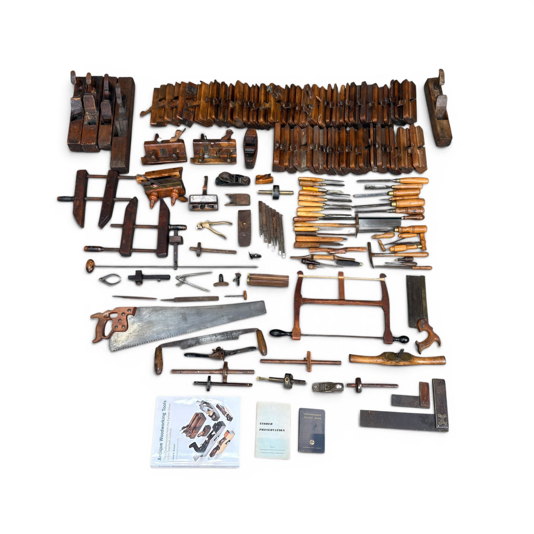 Collection of planes and woodworking tools including wood planes, chisels, hammers etc along with three books (Antique Woodworking Tools, Timber Preservation and Woodworkers Pocket Book)